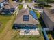 A well-maintained backyard featuring a patio, partial fence, and an exterior view of the installed solar panels at 9211 Seeger Ln, Land O Lakes, FL 34638