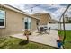 Outdoor patio with shaded pergola is perfect for relaxing and entertaining with a well maintained lawn at 9211 Seeger Ln, Land O Lakes, FL 34638