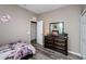 Cozy bedroom with wood floors, closet, mirror, dresser and Paris themed decorations at 9211 Seeger Ln, Land O Lakes, FL 34638