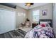 Cozy bedroom with wood floors, closet, hanging chair and Paris themed decorations at 9211 Seeger Ln, Land O Lakes, FL 34638