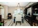 Open dining area offering wood-look flooring and a decorative light fixture at 9211 Seeger Ln, Land O Lakes, FL 34638