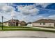 Charming home with well-maintained landscaping and a welcoming front yard, showcasing curb appeal at 9211 Seeger Ln, Land O Lakes, FL 34638