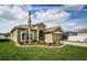 Inviting home showcasing mature landscaping and a cozy front exterior appeal at 9211 Seeger Ln, Land O Lakes, FL 34638