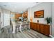 Kitchen island with breakfast bar seating, granite countertops, and wood cabinets at 9211 Seeger Ln, Land O Lakes, FL 34638