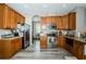 Well-equipped kitchen featuring stainless steel appliances and ample cabinet space at 9211 Seeger Ln, Land O Lakes, FL 34638