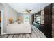 Bright living room featuring a comfortable sofa and a sliding door to the backyard at 9211 Seeger Ln, Land O Lakes, FL 34638
