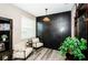 Stylish sitting area features accent wall, modern decor, and inviting ambiance at 9211 Seeger Ln, Land O Lakes, FL 34638