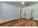 Bright bedroom features wood-look floors and access to ensuite bathroom at 9407 Black Thorn Loop, Land O Lakes, FL 34638