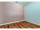 This bedroom has wood floors and is painted pink at 9407 Black Thorn Loop, Land O Lakes, FL 34638