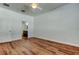 Bright bedroom features wood-look floors and access to ensuite bathroom at 9407 Black Thorn Loop, Land O Lakes, FL 34638
