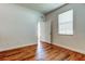 Bright bedroom features wood-look floors and a window at 9407 Black Thorn Loop, Land O Lakes, FL 34638