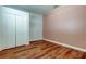 Bedroom with wood floors and closet at 9407 Black Thorn Loop, Land O Lakes, FL 34638