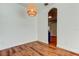 Dining space with hardwood floors, pendant light, arched doorway and neutral walls, perfect for gatherings at 9407 Black Thorn Loop, Land O Lakes, FL 34638