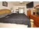 Bright bedroom showcasing a king-size bed, tv, dresser, and elegant decor at 9805 Hermosillo Dr, New Port Richey, FL 34655