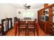 Cozy dining room with wood table, chairs, and built-in shelving at 9805 Hermosillo Dr, New Port Richey, FL 34655