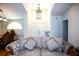 Grand foyer with high ceilings, elegant chandelier, and stylish furnishings, creating a welcoming entrance to the home at 9805 Hermosillo Dr, New Port Richey, FL 34655