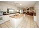Well-equipped kitchen with modern appliances, spacious countertops, and an island, perfect for cooking and entertaining at 9805 Hermosillo Dr, New Port Richey, FL 34655