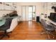 Bright home office with built in desks and pool views through the sliding glass doors at 9805 Hermosillo Dr, New Port Richey, FL 34655