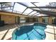 Tranquil screened pool with a patio area, perfect for entertaining and relaxing at 9805 Hermosillo Dr, New Port Richey, FL 34655