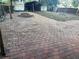 Backyard features full brick pavers with partial lawn and privacy fence at 902 Estelle Ave, Brandon, FL 33511
