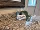 Granite countertops adorn the vanity of this well-lit bathroom at 902 Estelle Ave, Brandon, FL 33511