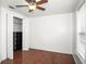 A bedroom featuring a closet with black shelving and hardwood floors at 902 Estelle Ave, Brandon, FL 33511