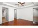 A spacious bedroom featuring hardwood floors and multiple entry doors at 902 Estelle Ave, Brandon, FL 33511