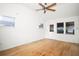 The bonus room features hardwood floors, a ceiling fan and has a back door for outdoor access at 902 Estelle Ave, Brandon, FL 33511