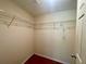 An ample walk-in closet with metal rack shelving at 902 Estelle Ave, Brandon, FL 33511