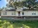 Charming single-story home with a welcoming front porch and well-lit windows, perfect for a cozy lifestyle at 902 Estelle Ave, Brandon, FL 33511