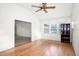 Bright living room features light hardwood floors, a vaulted ceiling, and several large windows to let in natural light at 902 Estelle Ave, Brandon, FL 33511