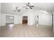Open living room with tile floors, high ceilings, and ample natural light at 902 Estelle Ave, Brandon, FL 33511