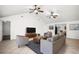 Bright living room featuring tile flooring, ceiling fans, and comfortable seating arrangement at 902 Estelle Ave, Brandon, FL 33511