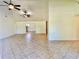 Spacious living room with tile floors, high ceilings, and dual ceiling fans offers ample living space at 902 Estelle Ave, Brandon, FL 33511
