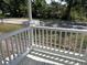 Front porch with white railing and floor and a welcome sign at 902 Estelle Ave, Brandon, FL 33511