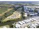 Panoramic aerial view of a waterfront community with canals and mobile homes, showcasing a peaceful residential area at 101 W Saint Johns Way, Apollo Beach, FL 33572