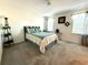 Serene bedroom with carpeted floor, neutral walls, natural light, and a calming color palette at 101 W Saint Johns Way, Apollo Beach, FL 33572