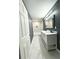 Stylish bathroom showcasing a double sink vanity, modern fixtures, and a clean, bright design at 1039 N Missouri Ave, Clearwater, FL 33755