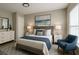 Charming bedroom featuring a comfortable bed, stylish decor, and ample storage space at 1039 N Missouri Ave, Clearwater, FL 33755