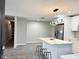 Open kitchen featuring stainless steel appliances, marble countertops, and a convenient breakfast bar at 1039 N Missouri Ave, Clearwater, FL 33755
