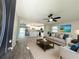 Bright, open-concept living room with modern furnishings and a seamless flow into the kitchen at 1039 N Missouri Ave, Clearwater, FL 33755