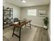 Functional home office with a spacious desk, shelving, and a serene atmosphere at 1039 N Missouri Ave, Clearwater, FL 33755