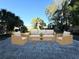 Outdoor patio with elegant outdoor seating, ideal for enjoying the lush, tropical views at 1039 N Missouri Ave, Clearwater, FL 33755