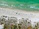 Breathtaking view of the beach with crystal-clear waters and white sand shoreline at 112 79Th St # B, Holmes Beach, FL 34217