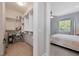 Walk-in closet with built in shelving and racks adjacent to the bedroom at 112 79Th St # B, Holmes Beach, FL 34217
