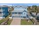 Beautiful blue two-story home with a metal roof and welcoming front porch at 112 79Th St # B, Holmes Beach, FL 34217