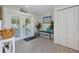Bright and inviting foyer with tile flooring, double doors to the pool, and stylish decor, offering a warm welcome at 112 79Th St # B, Holmes Beach, FL 34217