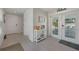 Light-filled foyer with tile floors, leading to double doors, blending indoor elegance and outdoor allure at 112 79Th St # B, Holmes Beach, FL 34217