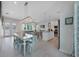 Bright, open living space with a modern kitchen, dining area, and inviting living room, perfect for entertaining at 112 79Th St # B, Holmes Beach, FL 34217