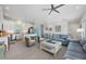 Open-concept living space featuring a stylish kitchen, cozy living area, and ample natural light for comfortable living at 112 79Th St # B, Holmes Beach, FL 34217